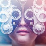 PE targets eye care assets: 6 deals A woman's eyes are tested using a Photopter , determining whether she is due for an update in glasses prescription. Could also depict an ophthalmologist. Colorful lights add a futuristic feel to the image.