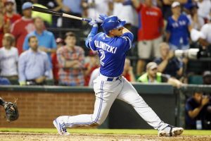 Toronto's Troy Tulowitzki hits a three-run homer in the sixth inning of the Blue Jays' 5-1 win over the Rangers in Game 3 of the ALDS on Sunday. | USA TODAY / REUTERS