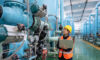 Chemical production interior, female worker