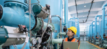 Chemical production interior, female worker