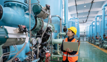 Chemical production interior, female worker