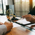 Top commercial law firms consider PE investment amid AI worries, says Lincoln; Castlelake PUSU deadline for Easyjet extended Lawyer is explaining about the wrongdoing laws regarding fraud to the client at the office.