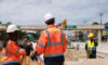 UK built environment pulls in private equity; Providence Equity featured in They Said It Construction engineer talking to architect at industrial construction site in road construction site (Getty)