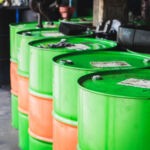 Industry oil barrels tank at the garage background.