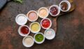 Picture of dipping sauces and condiments on a rustic background.