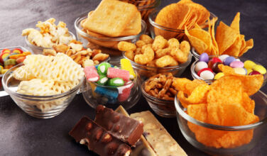 Butterfly to buy food packager Sabert; Main Post, CapVest invest in snacking; NBA amends PE rule Salty snacks. Pretzels, chips, crackers in glass bowls.