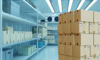 Boxes are in a warehouse with a refrigerator. Refrigeration chamber for food storage.