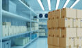 Boxes are in a warehouse with a refrigerator. Refrigeration chamber for food storage.