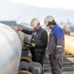 Non-destructive testing technicians are checking welds of pipe with ultrasonic testing (UT) method_Getty