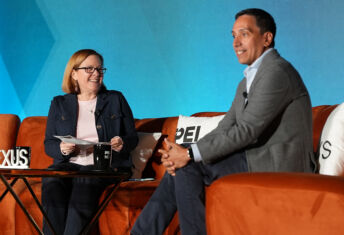 PEI Group's MK Flynn and Clearlake's José E. Feliciano on stage at NEXUS 2026