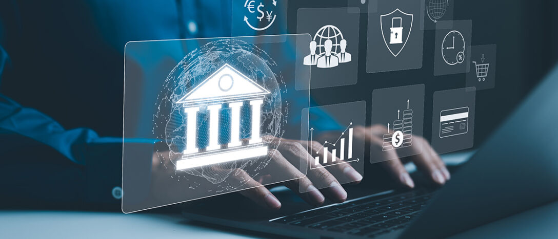 Close up shot of hands typing on a laptop with overlays of digital banking icons