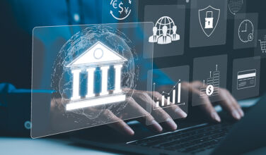 Wealth, insurance and fintech drive thriving PE-backed financial services M&A Close up shot of hands typing on a laptop with overlays of digital banking icons