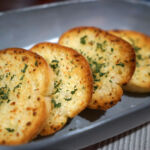 Short and sweet: E2P sold Furlani Foods to Arbor Investments after a three-year hold Close up Sliced garlic and butter bread toast