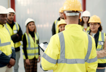 Construction, teamwork and people in meeting for planning, brainstorming and discussion in building. Architecture, engineering and men and women for inspection, property development and project