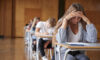‘Zombie’ funds, unrealized assets, longer hold periods challenge PE model; Technology spending is driving education deals Anxious Teenage Student Sitting Examination In School Hall