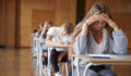 ‘Zombie’ funds, unrealized assets, longer hold periods challenge PE model; Technology spending is driving education deals Anxious Teenage Student Sitting Examination In School Hall