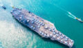 5 reasons private equity is betting big on US Naval investments Image of a military navy nuclear aircraft carrier, Military navy ship carrier full loading fighter jet aircraft.
