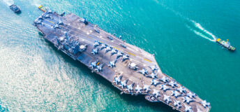 Image of a military navy nuclear aircraft carrier, Military navy ship carrier full loading fighter jet aircraft.