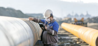 Technician ultrasonic pipeline detection_Getty