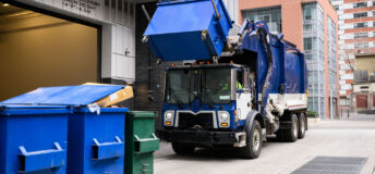 Garbage Truck Lifting Recycling Bin_Getty