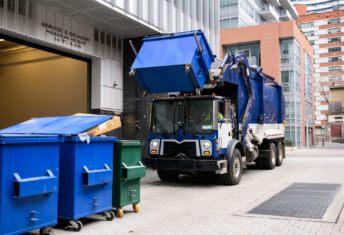 On the Block: Four environmental service providers coming to market shortly, sources say Garbage Truck Lifting Recycling Bin_Getty