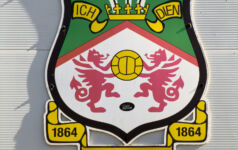 The sports private equity playbook: critical communications considerations Image of the official crest of Wrexham AFC, North Wales.
